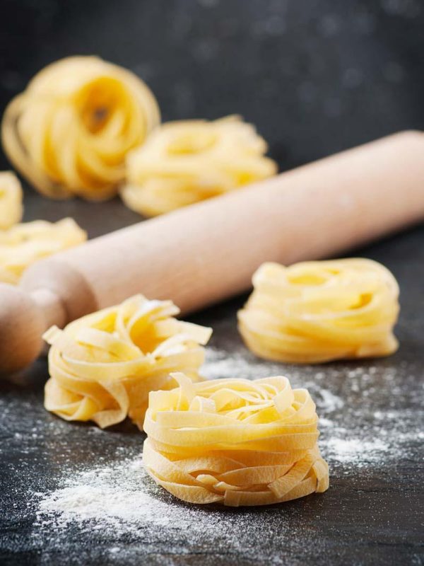 Sardinian traditional pasta malloreddus with sausage, selective focus